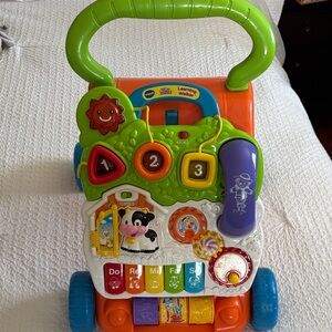 VTech Sit to Stand Colorful Learning Walker for Kids - Green, Orange, and Blue